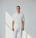 Men's textured polo with subtle vertical pattern